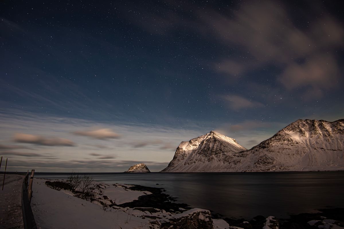 Winter starry night sky over a coastline