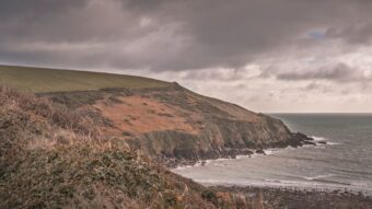 Moody autumn coastline in Ireland with grey skies in late October