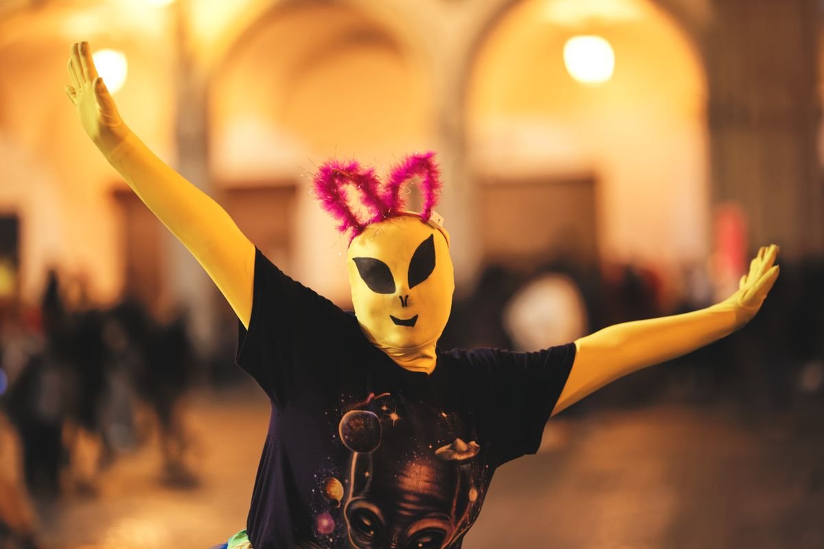 Halloween parade performer in costume at night