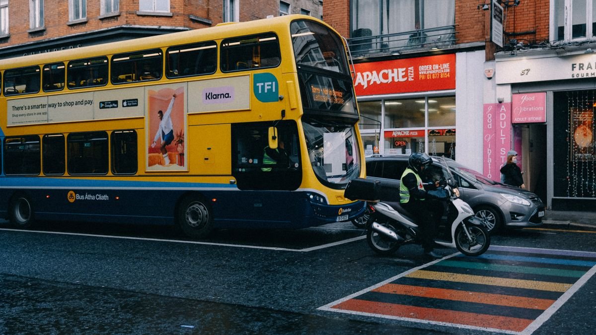 Yellow Dublin Bus double-decker on a city centre street