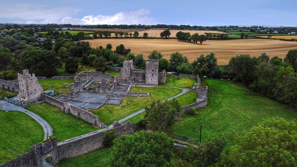 Stone monastery ruin in green Irish countryside