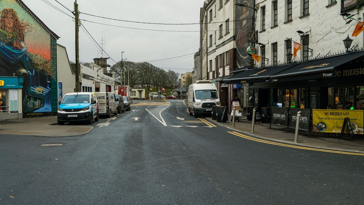 A Galway town street with parked cars