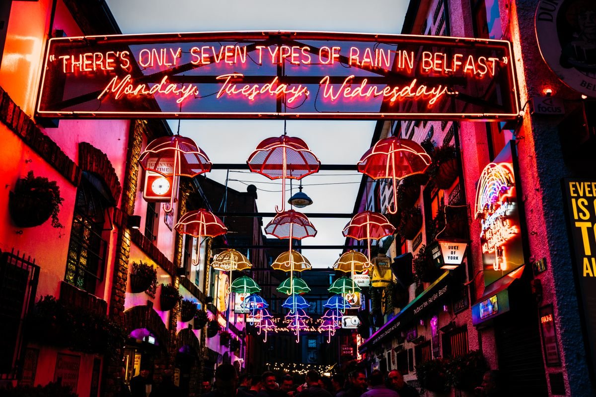 Commercial Court alley in the Belfast Cathedral Quarter with umbrellas strung overhead