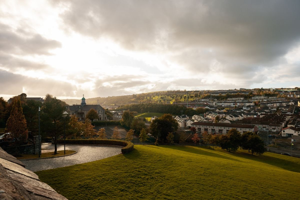 Late September light over an Irish town and green hills