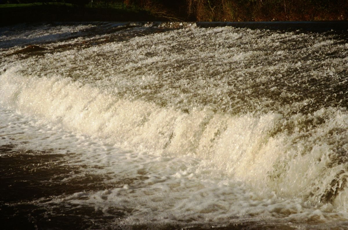 Waterfall running hard and white after heavy rain in Ireland