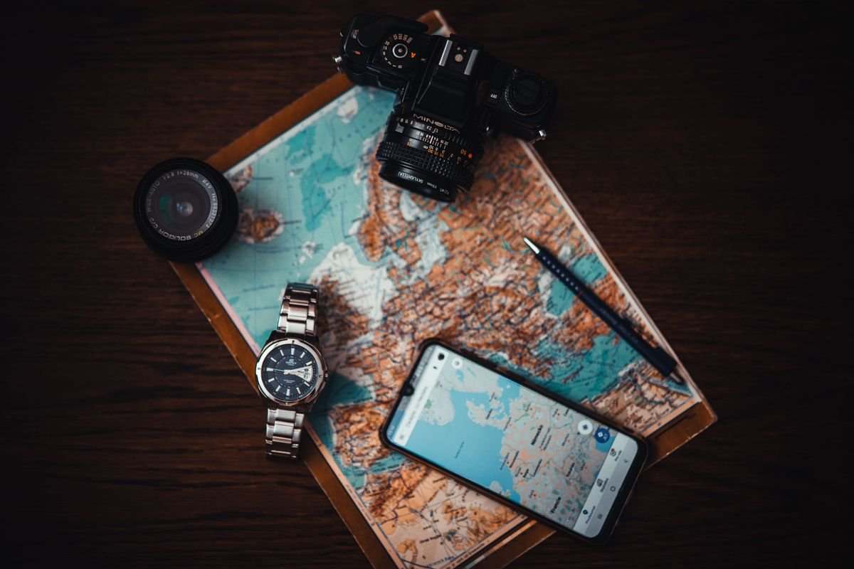 Ireland tour planning flatlay with map, camera and phone