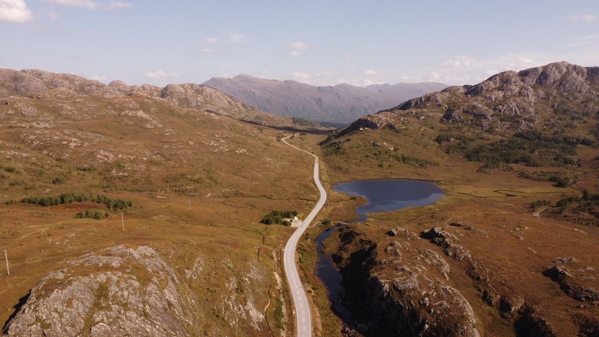 A road winding through the Scottish Highlands
