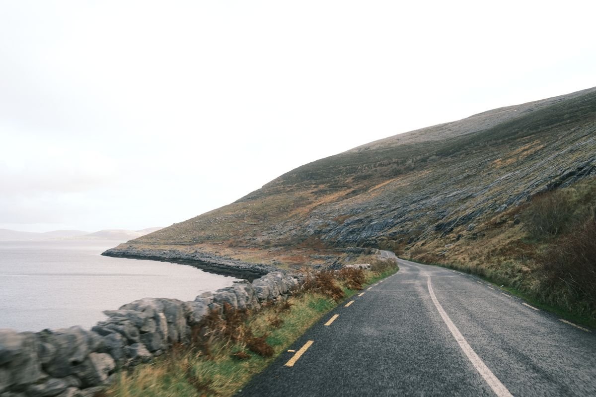 narrow rural coastal road along the west of Ireland