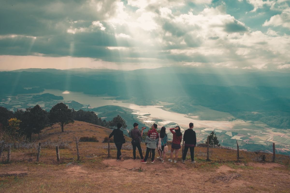 Small group of travellers at a mountain viewpoint
