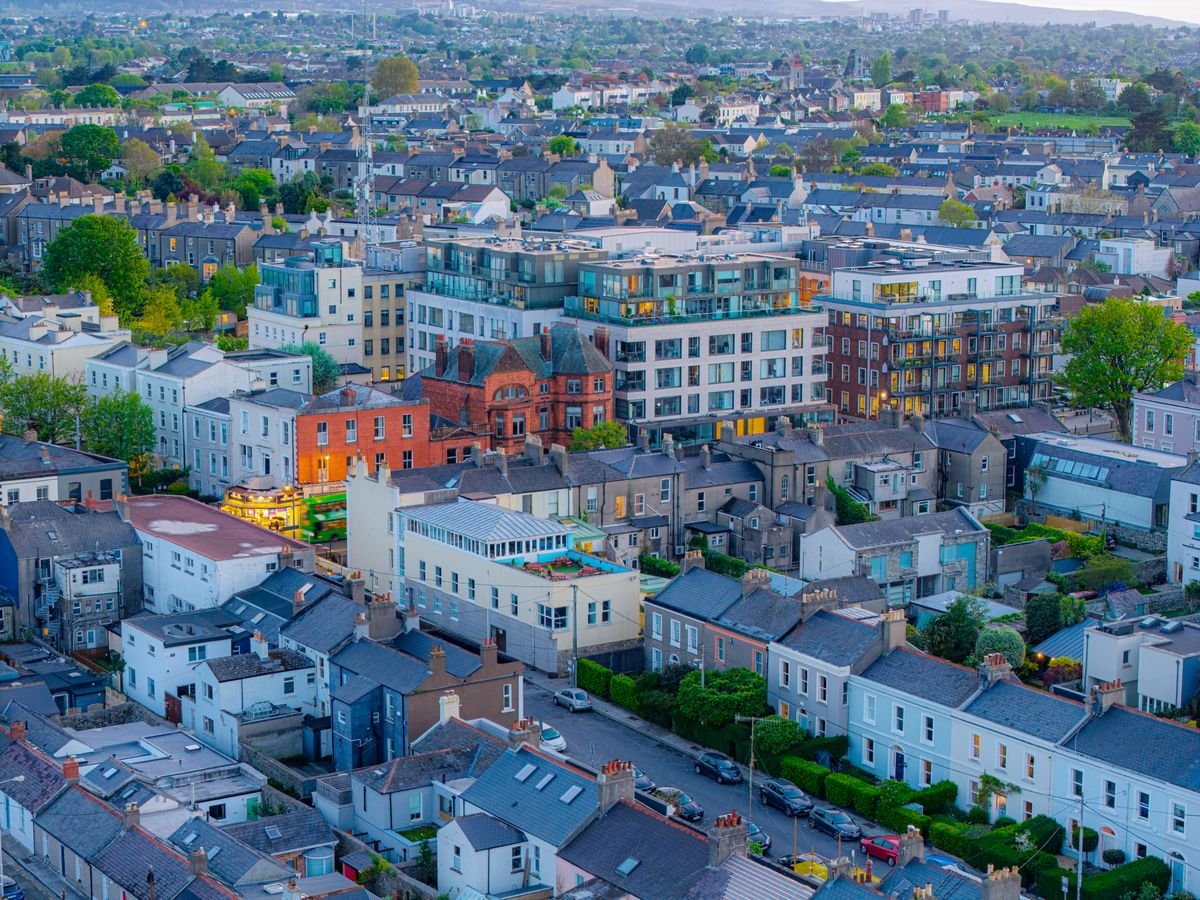Aerial view over red-brick terraces and apartments in a Dublin neighbourhood