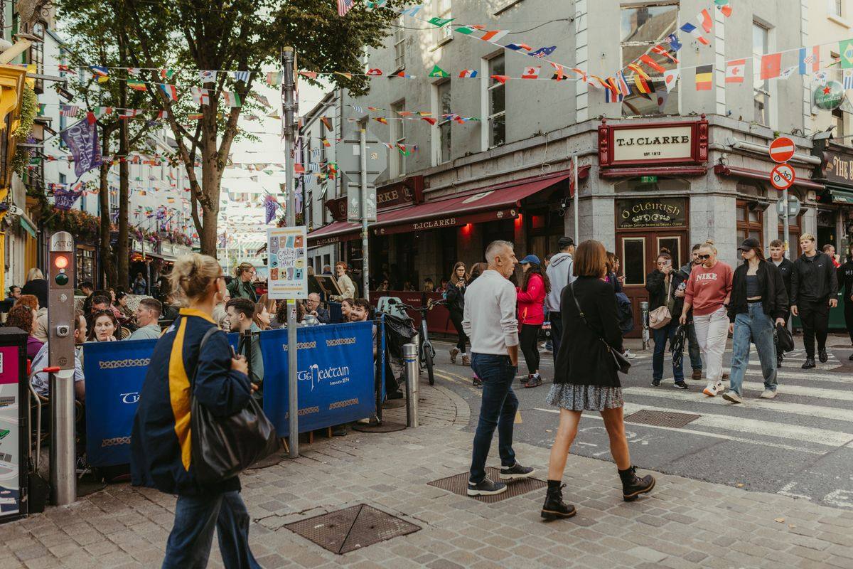 People walking a car-free street in Galway's Latin Quarter