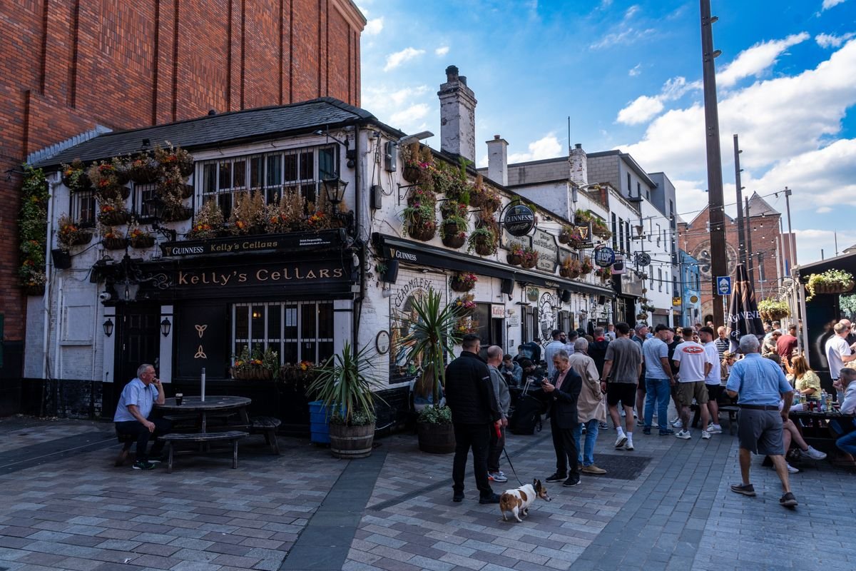 A Belfast city center street with people walking