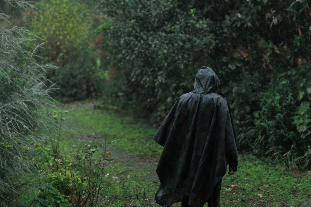 A rain jacket on a wet green path in the Irish hills