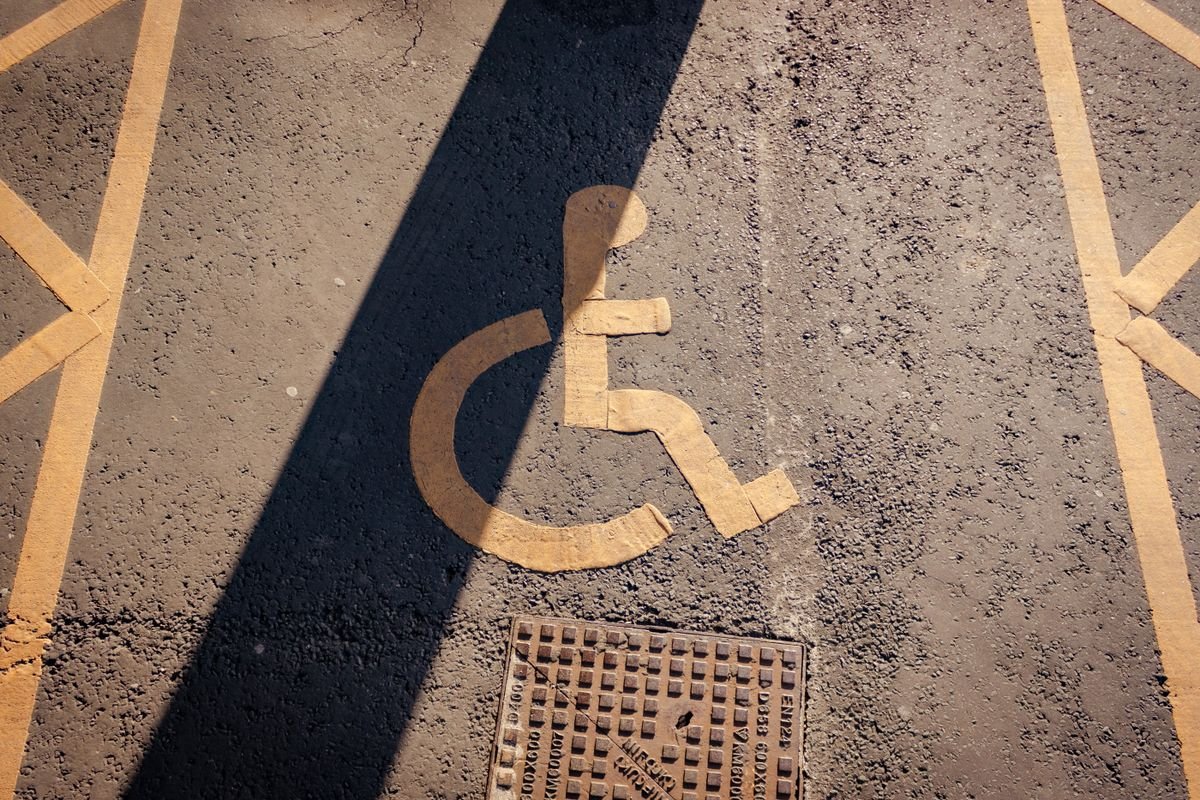 An accessible parking bay marked on the tarmac