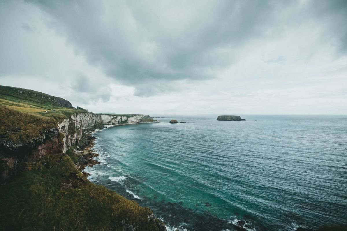 Moody clouds over the turquoise sea on the Causeway Coast