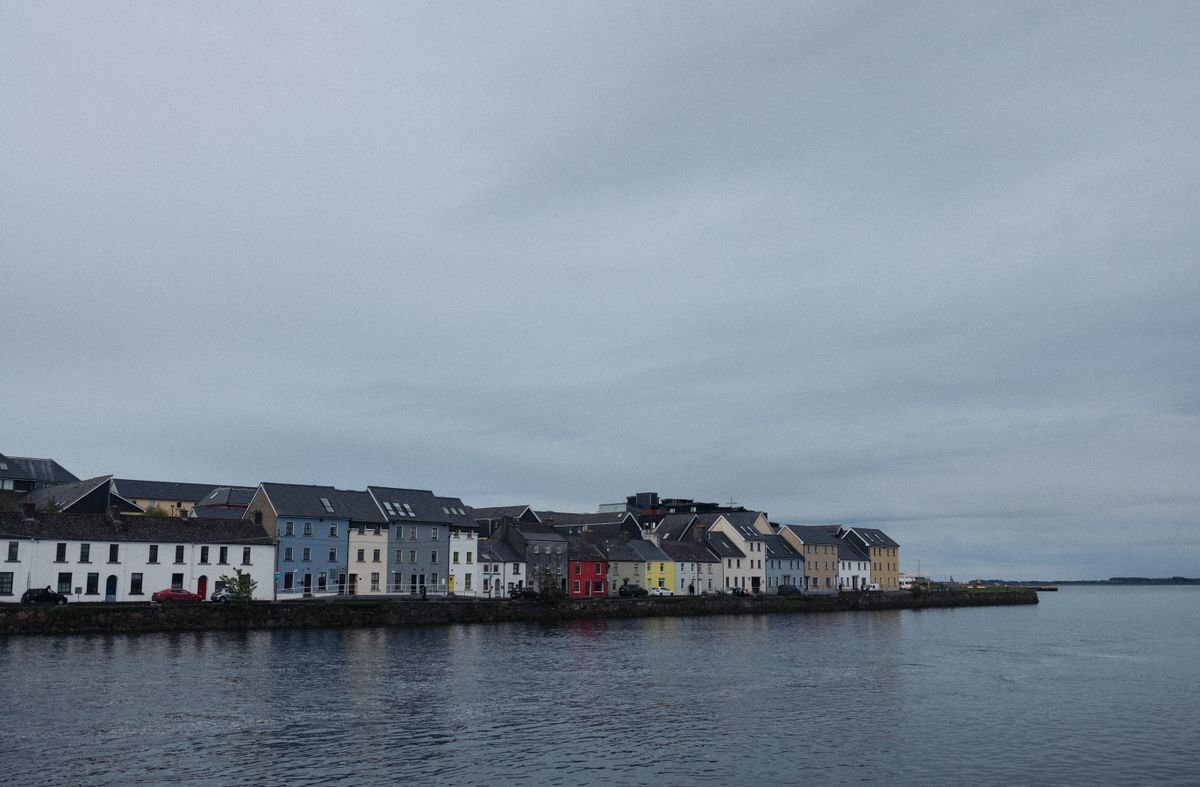 Colored houses along The Long Walk on Galway harbour