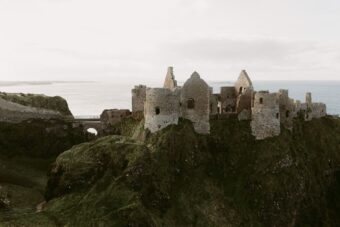 Dunluce Castle ruins on a sea crag on the Causeway Coast in County Antrim