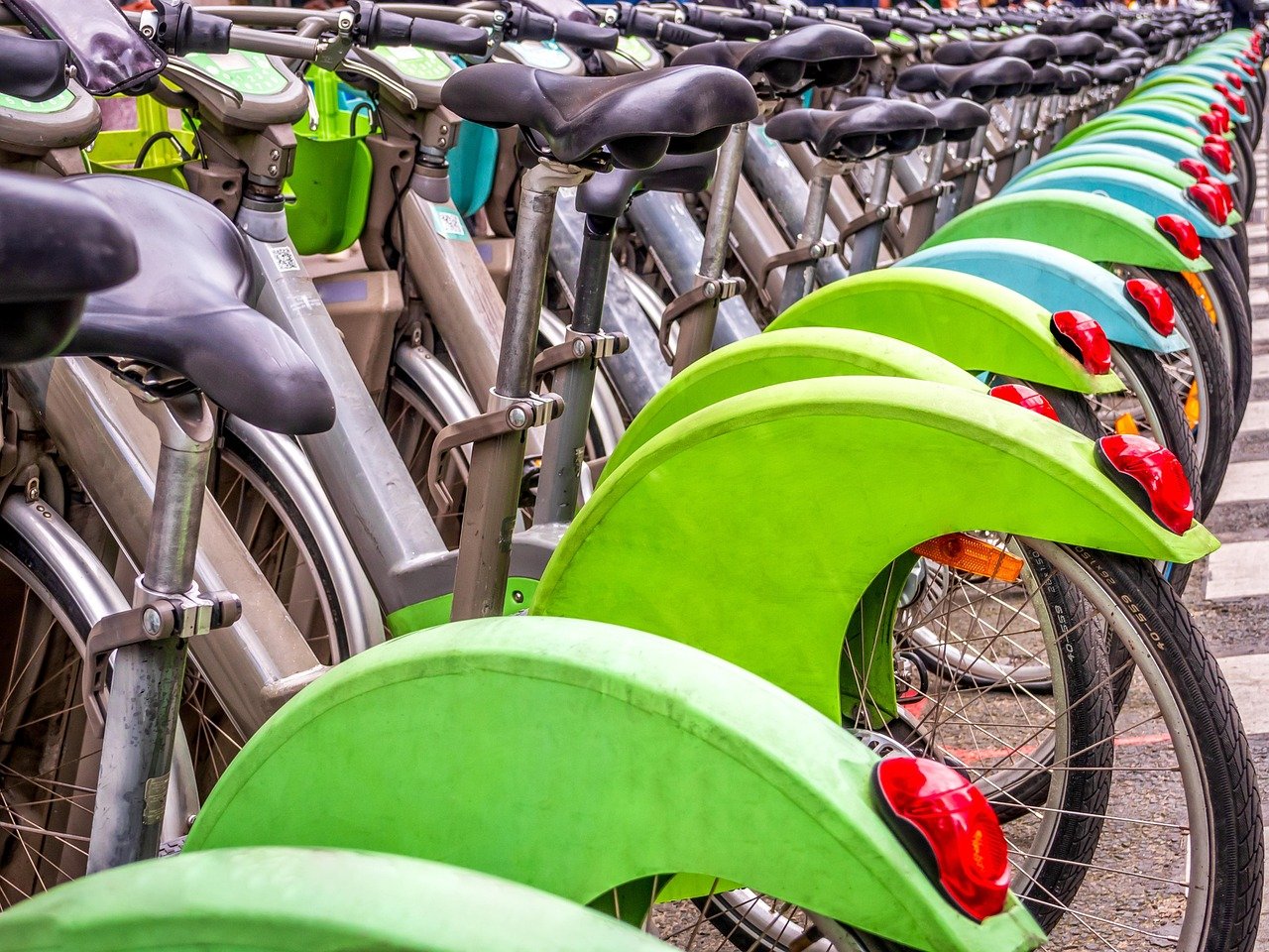 A row of rental bikes lined up ready for hire