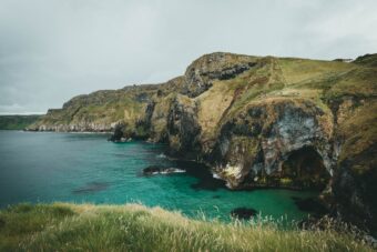 Rocky Antrim coast cliffs and turquoise sea in Northern Ireland