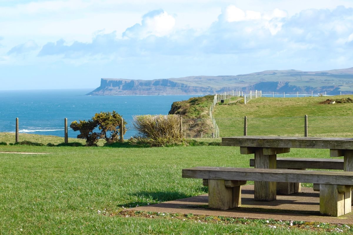Green headland and sea view on the Antrim coast near Ballycastle