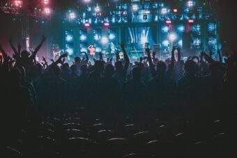 Crowd with hands up at an outdoor music festival in Ireland
