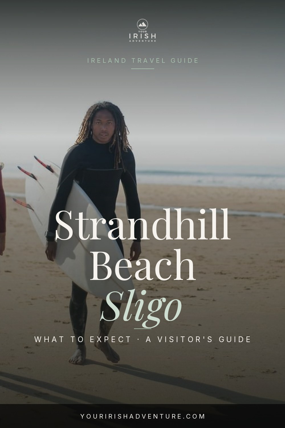 Atlantic waves rolling onto Strandhill Beach in County Sligo with surfers in the water