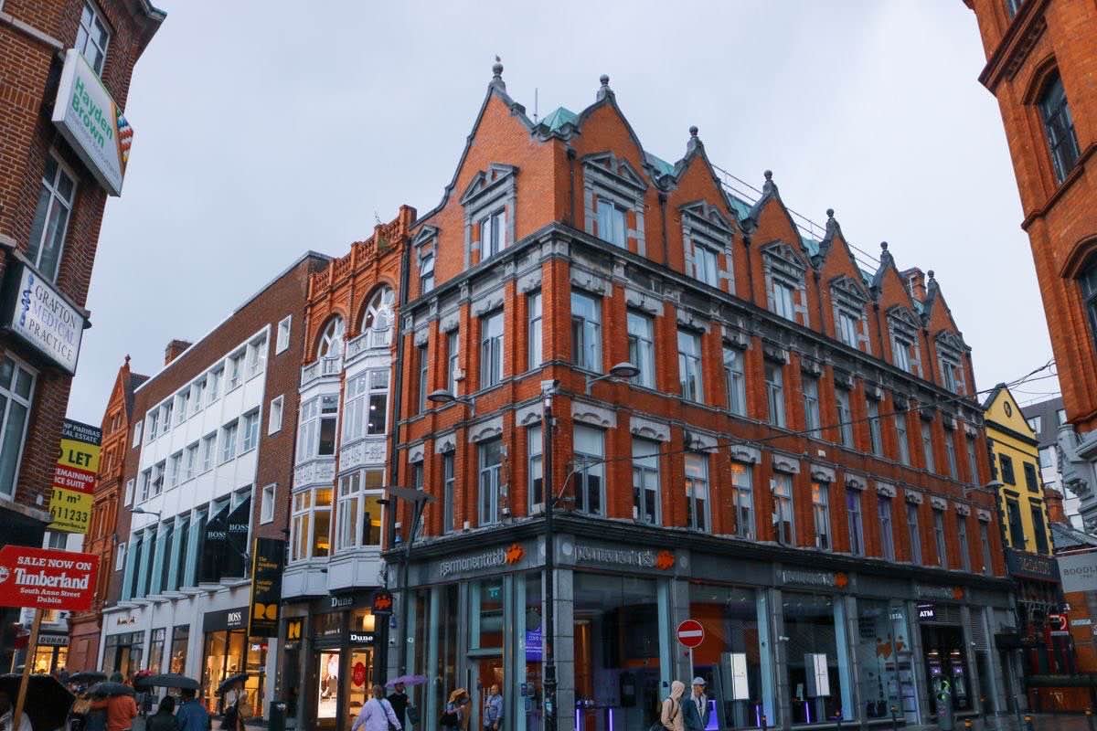 Red brick corner building on a Dublin street near Grafton Street
