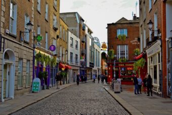Cobbled Temple Bar street with the red Temple Bar pub on the corner
