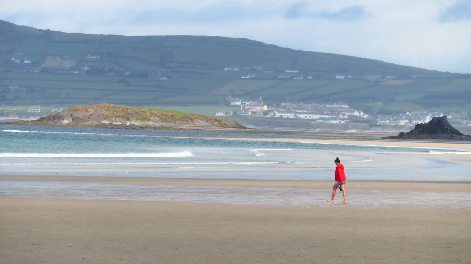 Wide open sand at Banna Strand near Tralee with hills behind