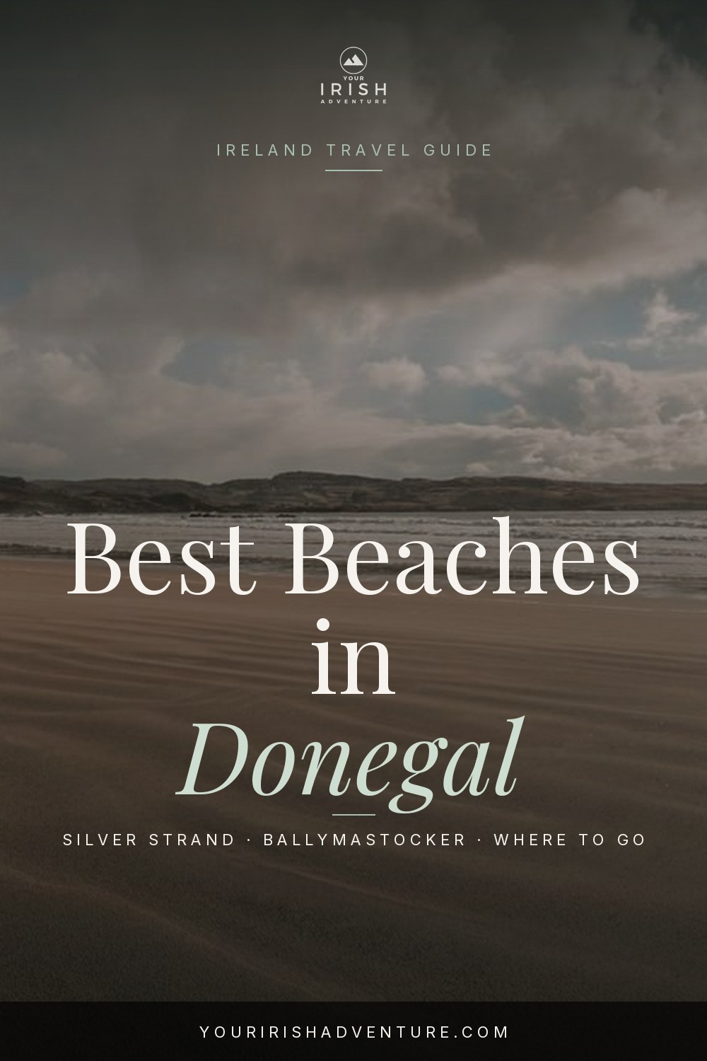 Golden sandy beach with turquoise water and green cliffs on the Donegal coast in Ireland