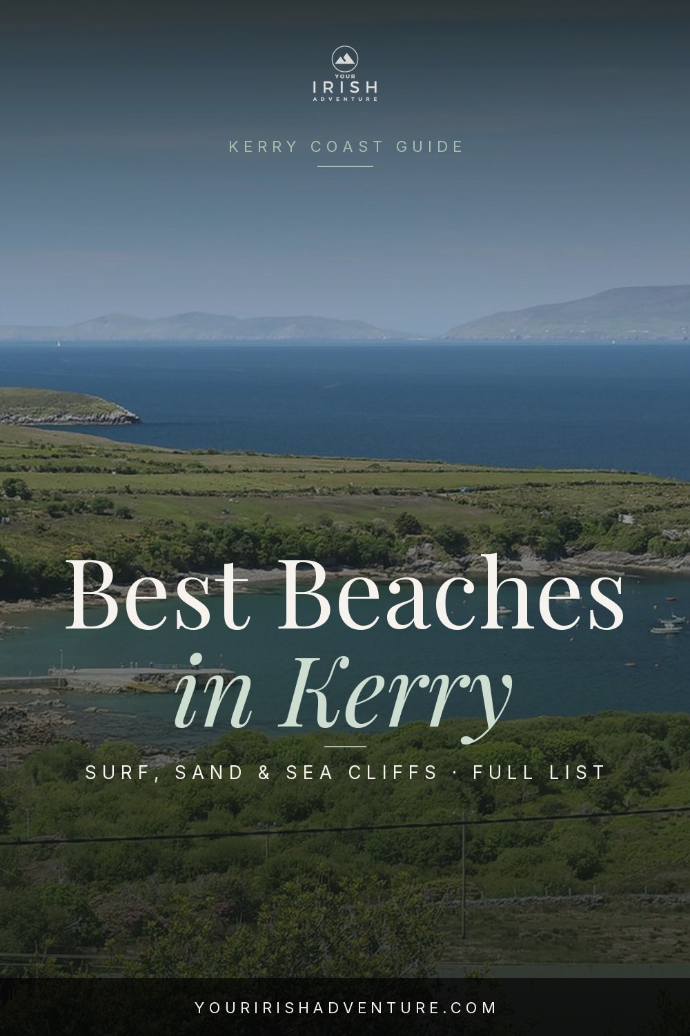 Rocky Kerry cove with clear water and a stretch of pale sand under cliffs
