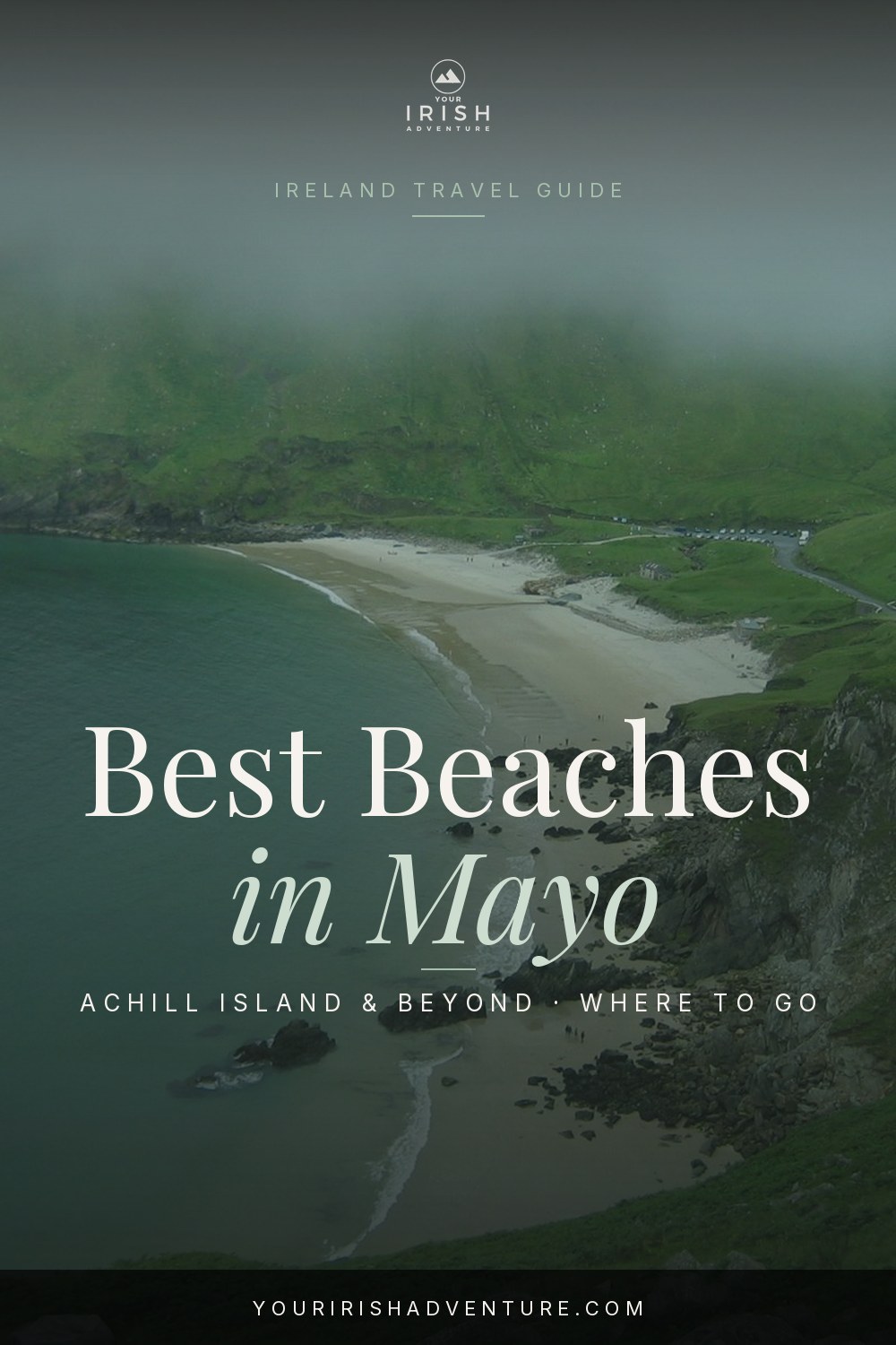 Golden sand beach on Achill Island backed by green cliffs in County Mayo Ireland