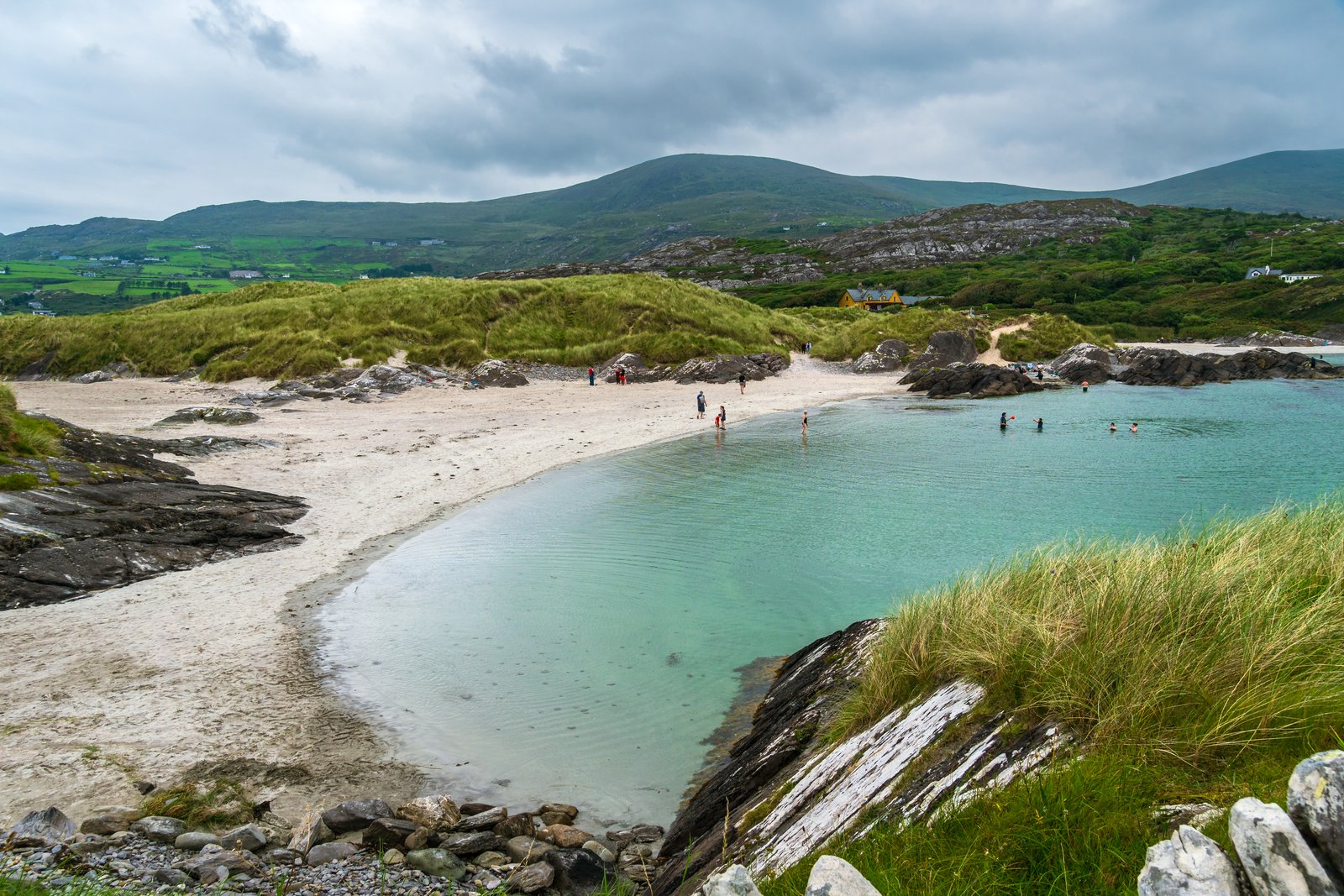 Sheltered white-sand cove with turquoise water at Derrynane on the Ring of Kerry