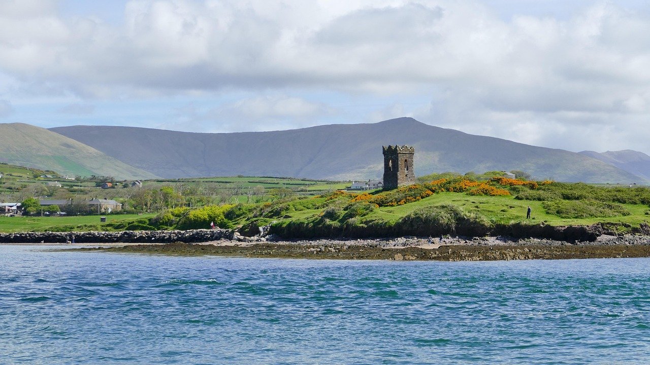Dingle harbour entrance with Husseys Folly watchtower and the Kerry hills behind