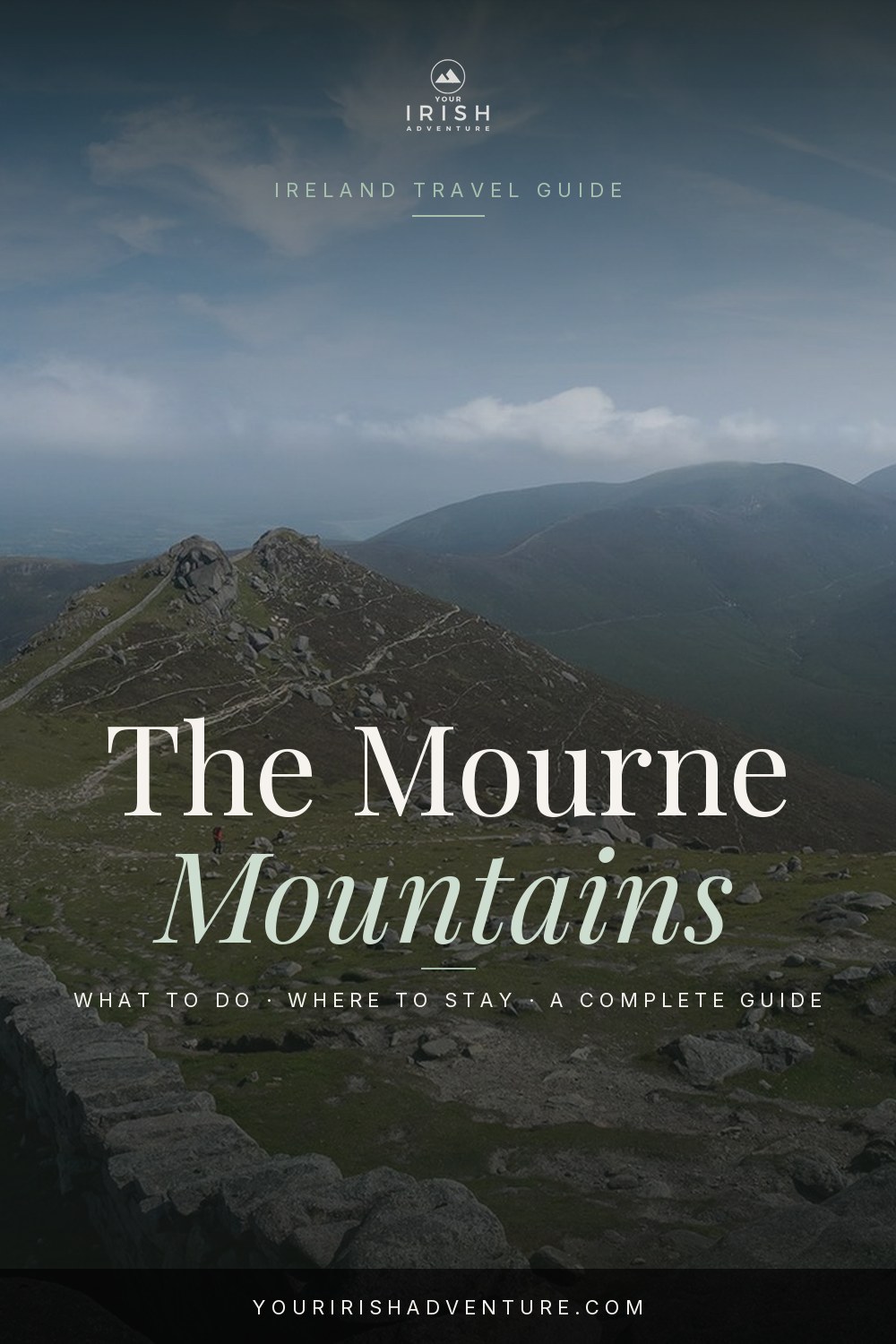 Granite peaks and the Mourne Wall winding across the Mourne Mountains in County Down Northern Ireland