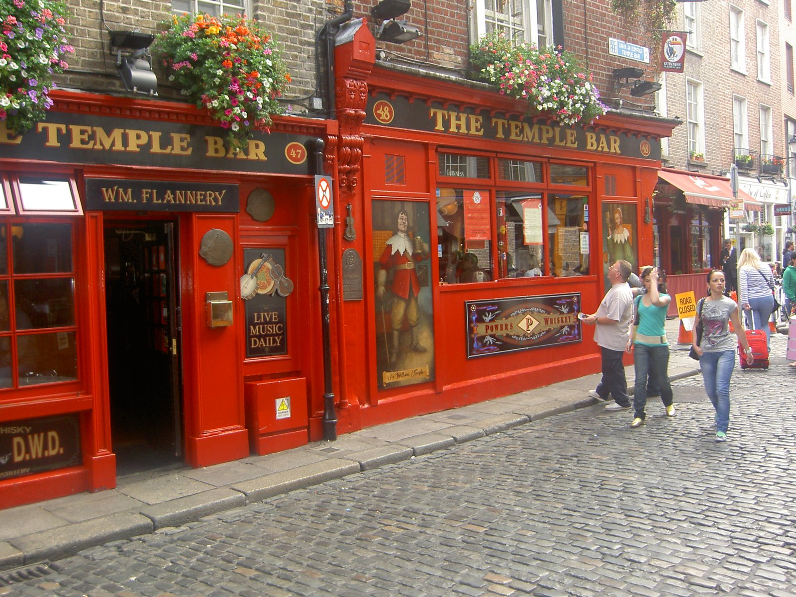 The red front of The Temple Bar, the pub that gives the Dublin quarter its name