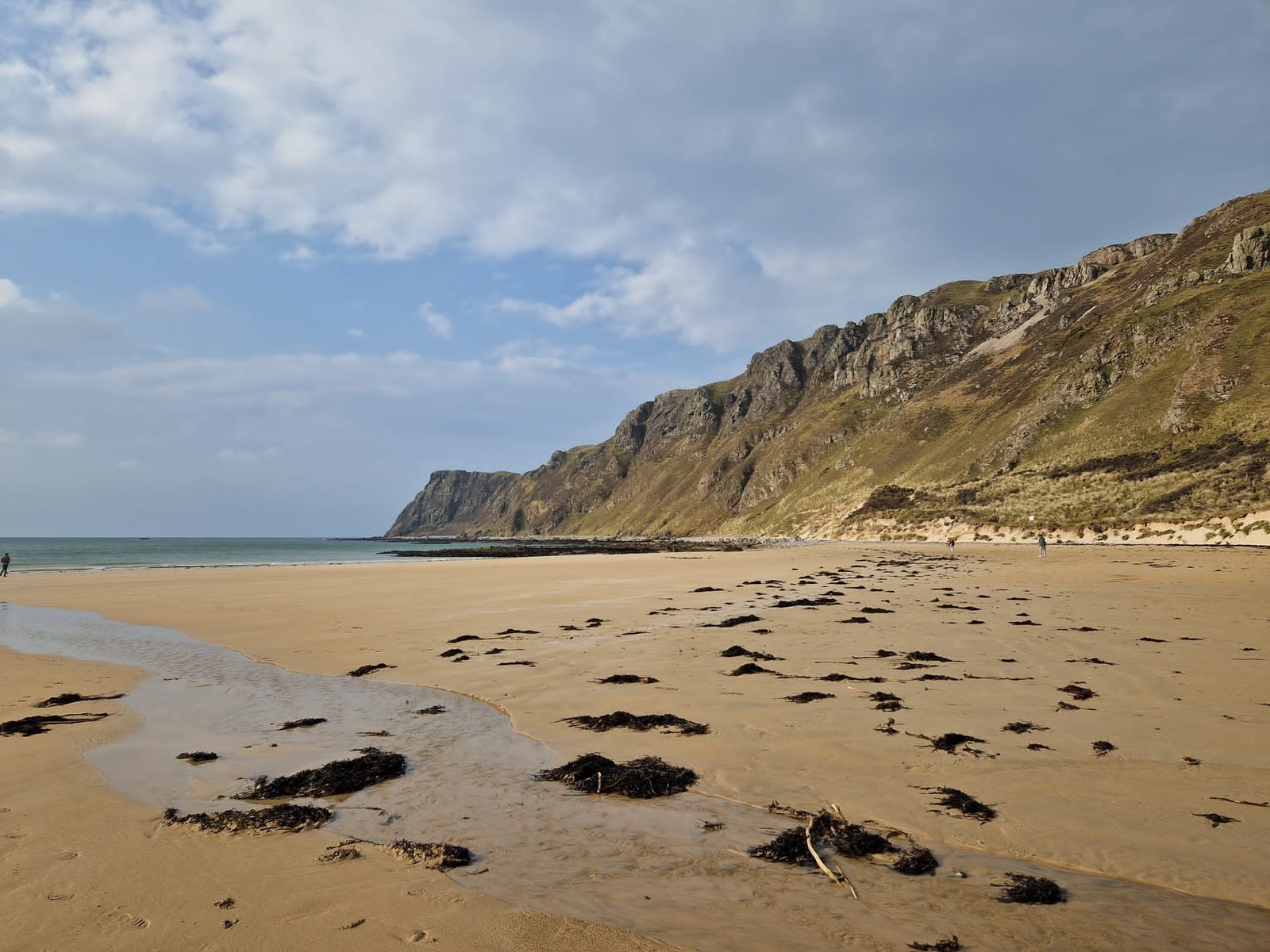 Five Finger Strand backed by tall dunes and cliffs near Malin Head, Donegal