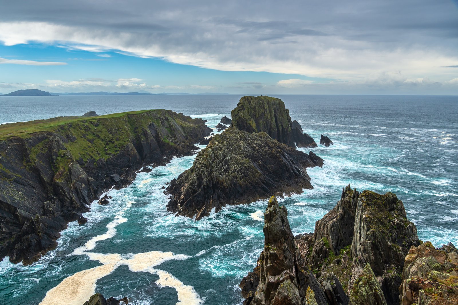 Jagged rocky headland and surf at Malin Head in County Donegal