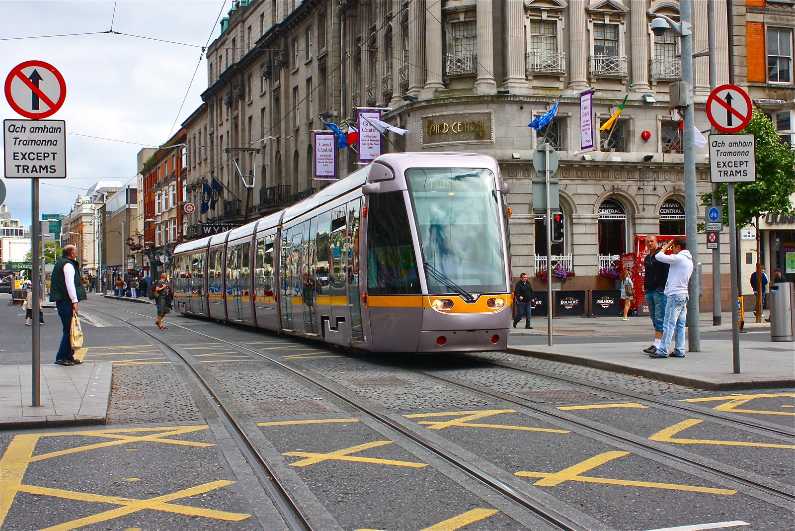 A Luas tram running down a Dublin city street