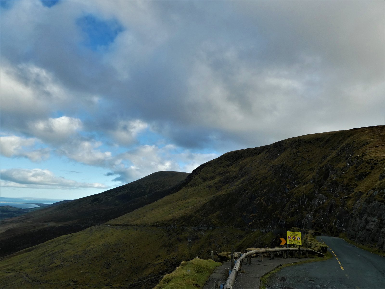 Narrow single track road climbing the Conor Pass on the Dingle Peninsula in County Kerry
