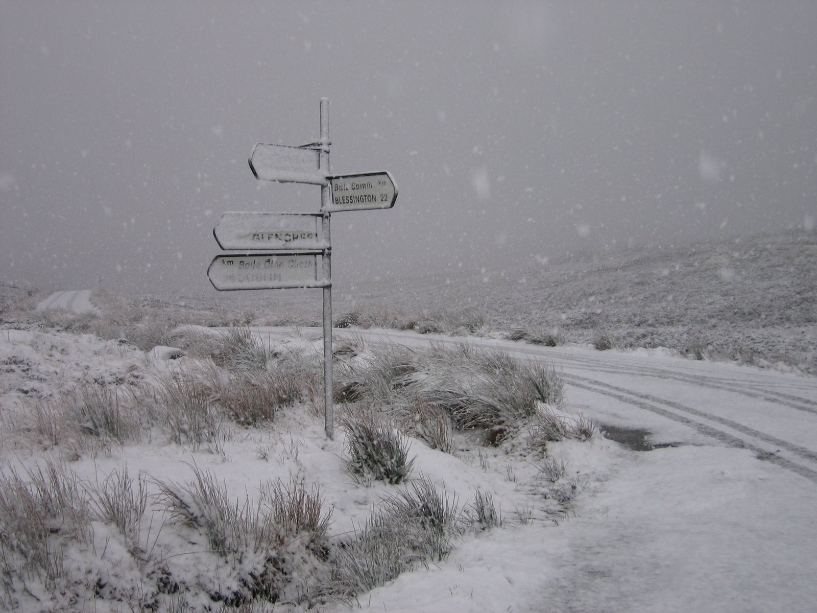 A snowy signpost on the high Wicklow Mountains road in winter