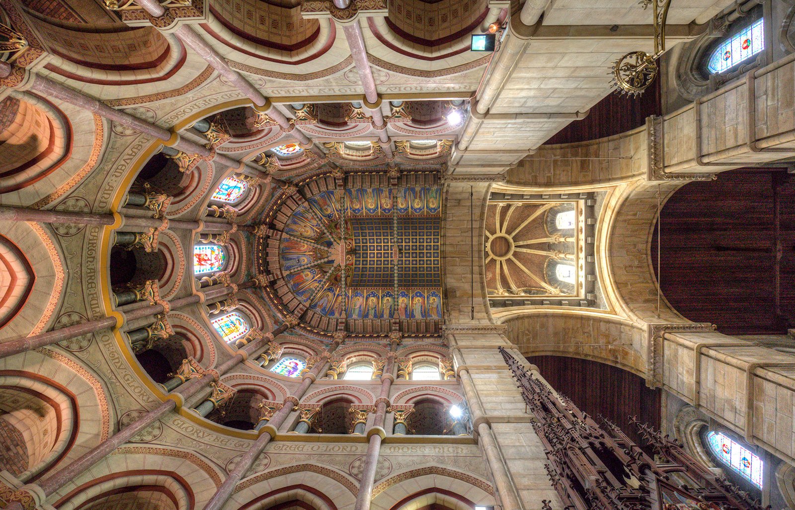 Decorated ceiling and stained glass inside St Fin Barre's Cathedral in Cork