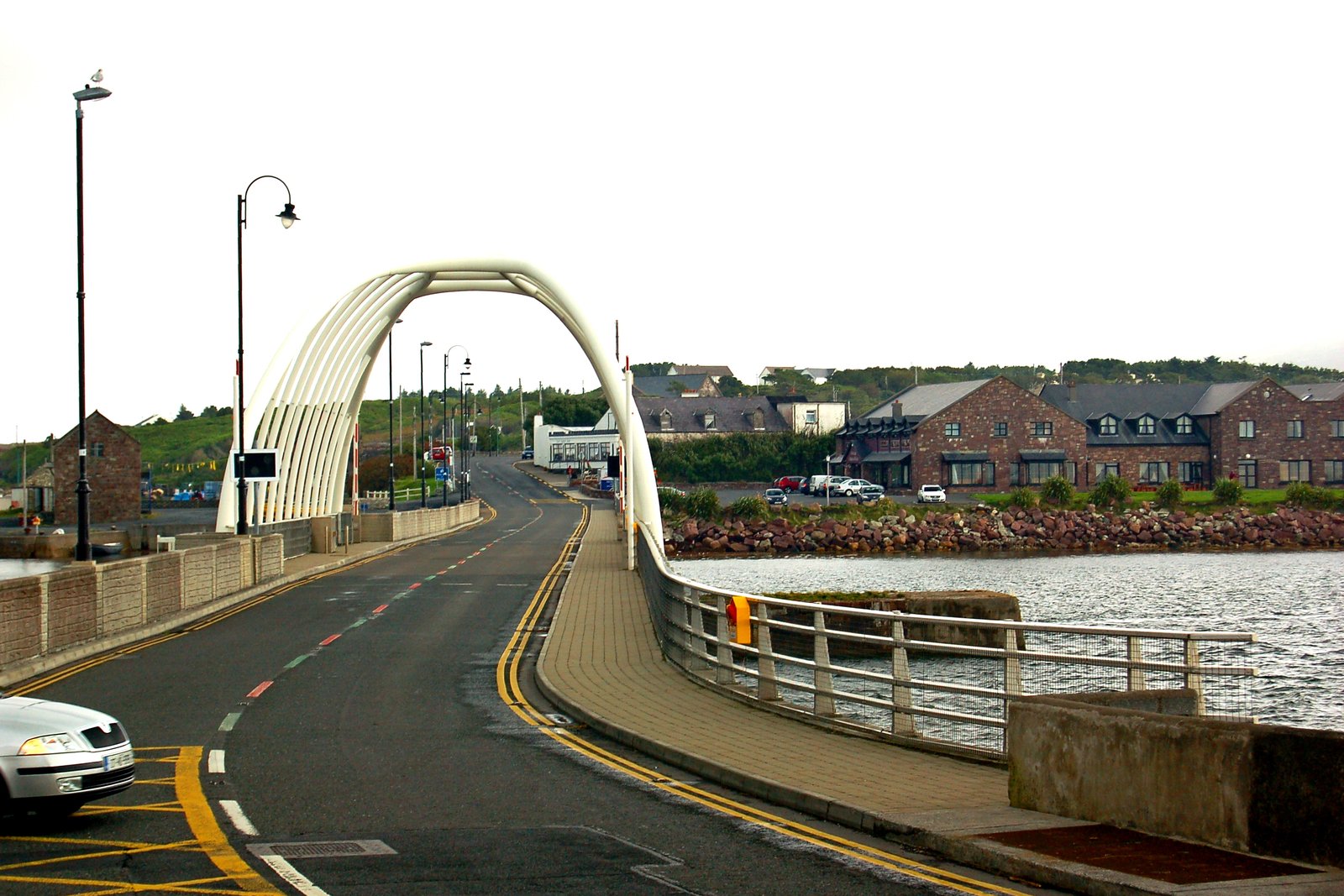 White arch road bridge crossing Achill Sound onto Achill Island