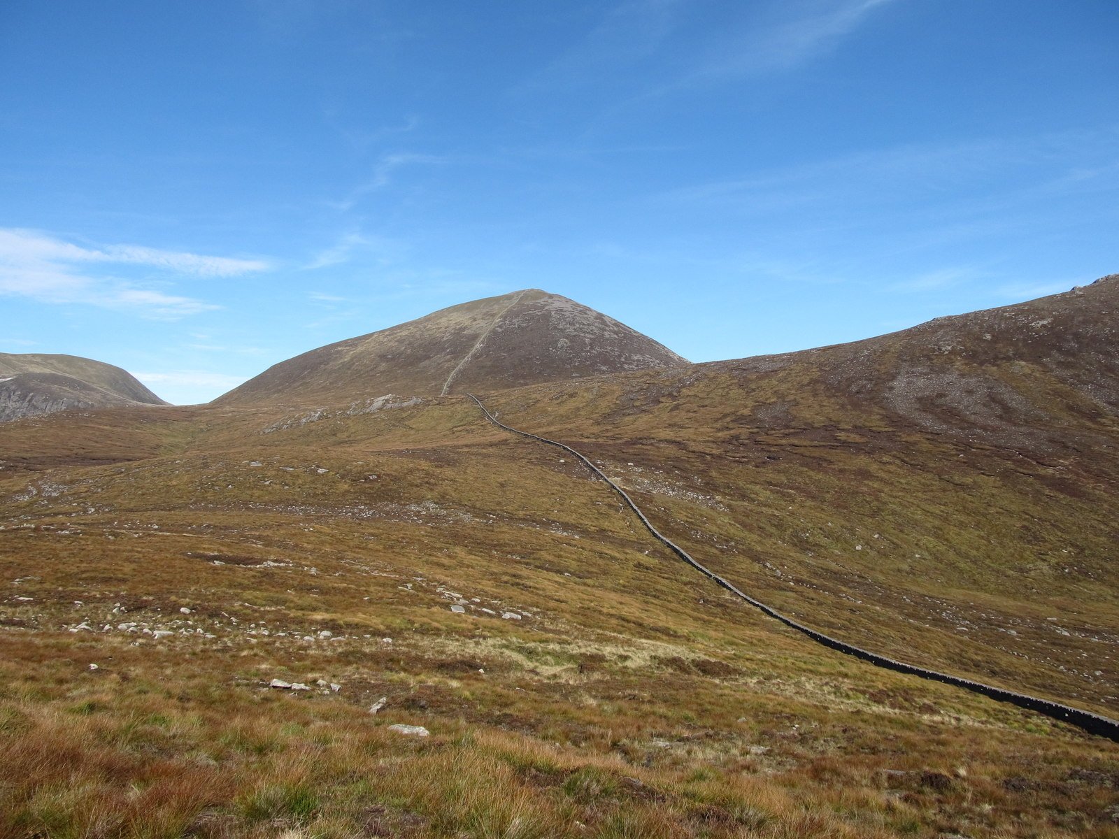 The Mourne Wall running up towards a summit in the Mourne Mountains
