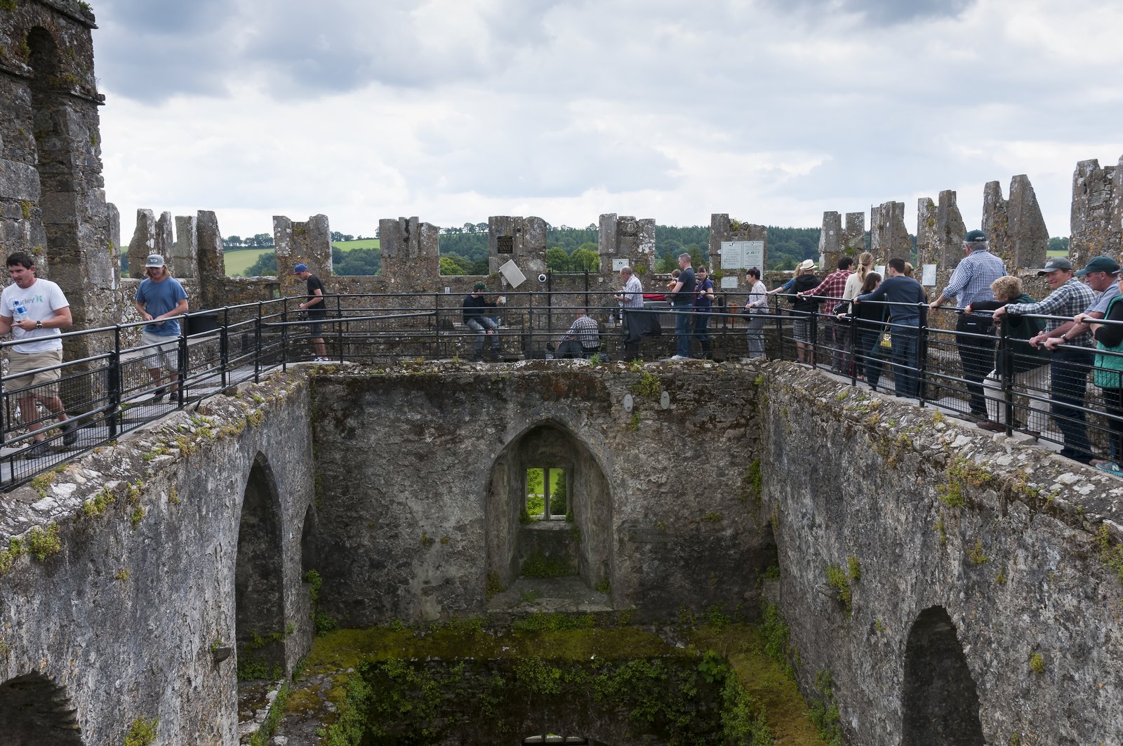 Visitors queuing along the top of Blarney Castle tower to kiss the Blarney Stone