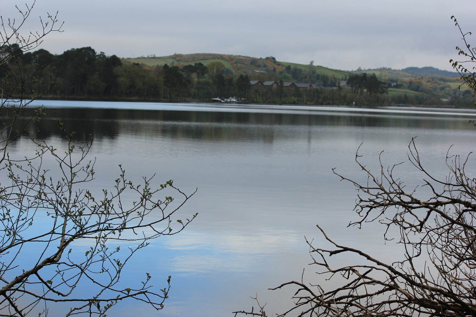 Calm water on Lower Lough Erne with green hills along the far shore in County Fermanagh