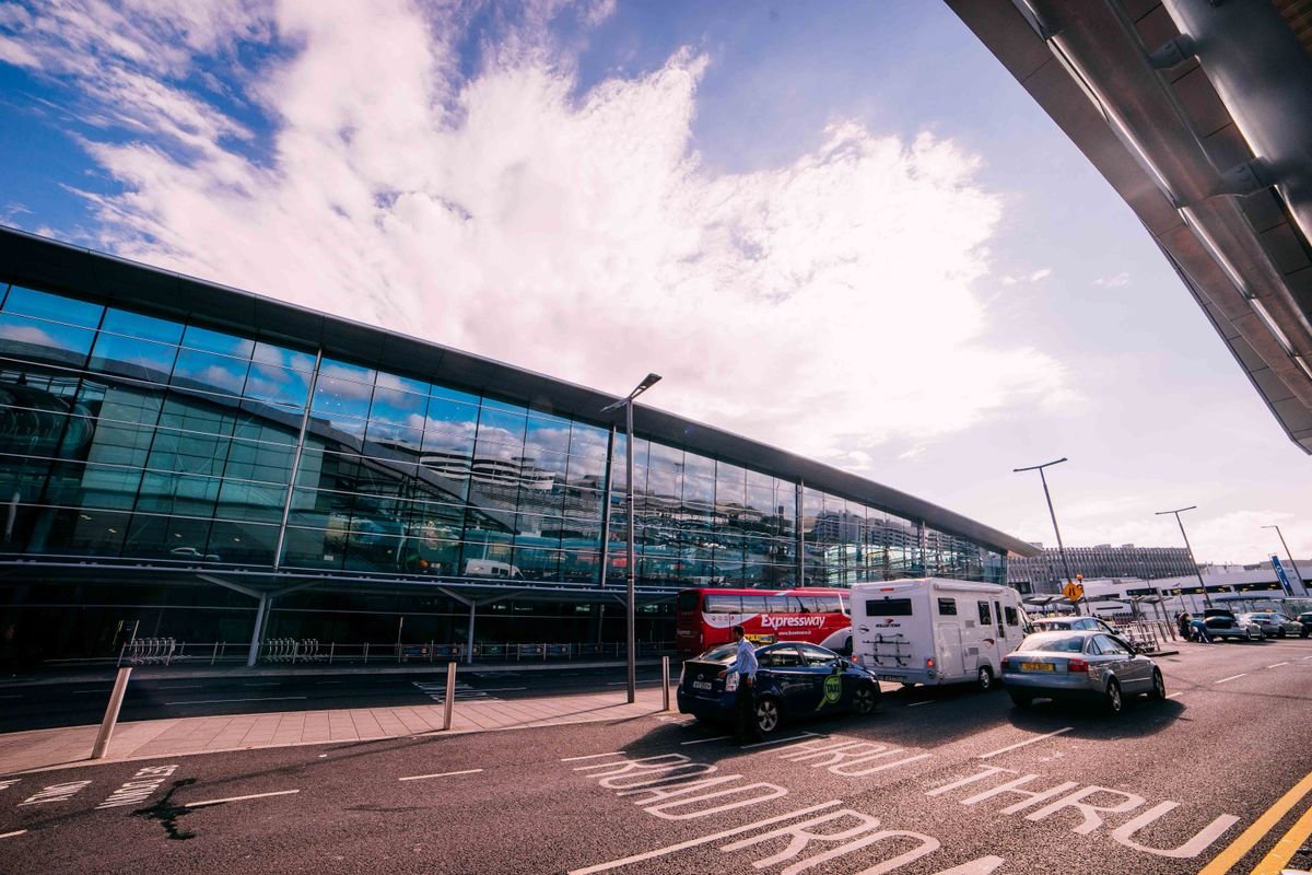 A Dublin Airport sightseeing coach and taxis outside the terminal