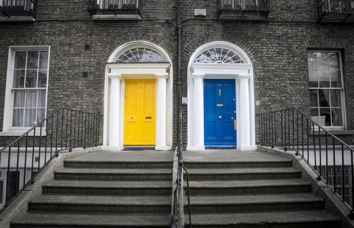 Yellow and blue Georgian townhouse doors in Dublin