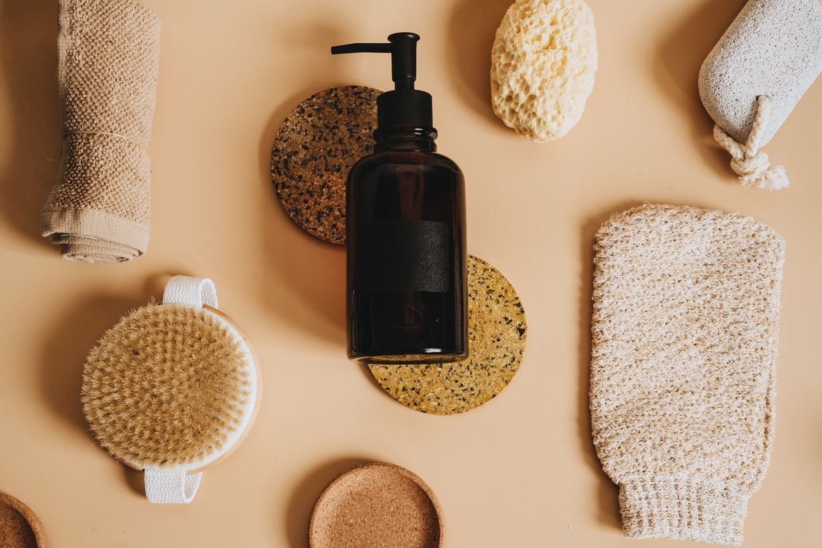 Travel toiletries and body care laid out on a table