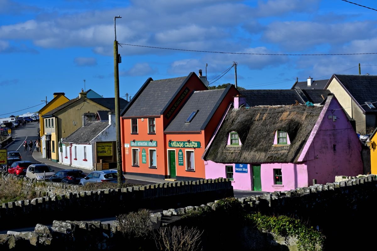 Row of colourful houses and shops along the street in Doolin village